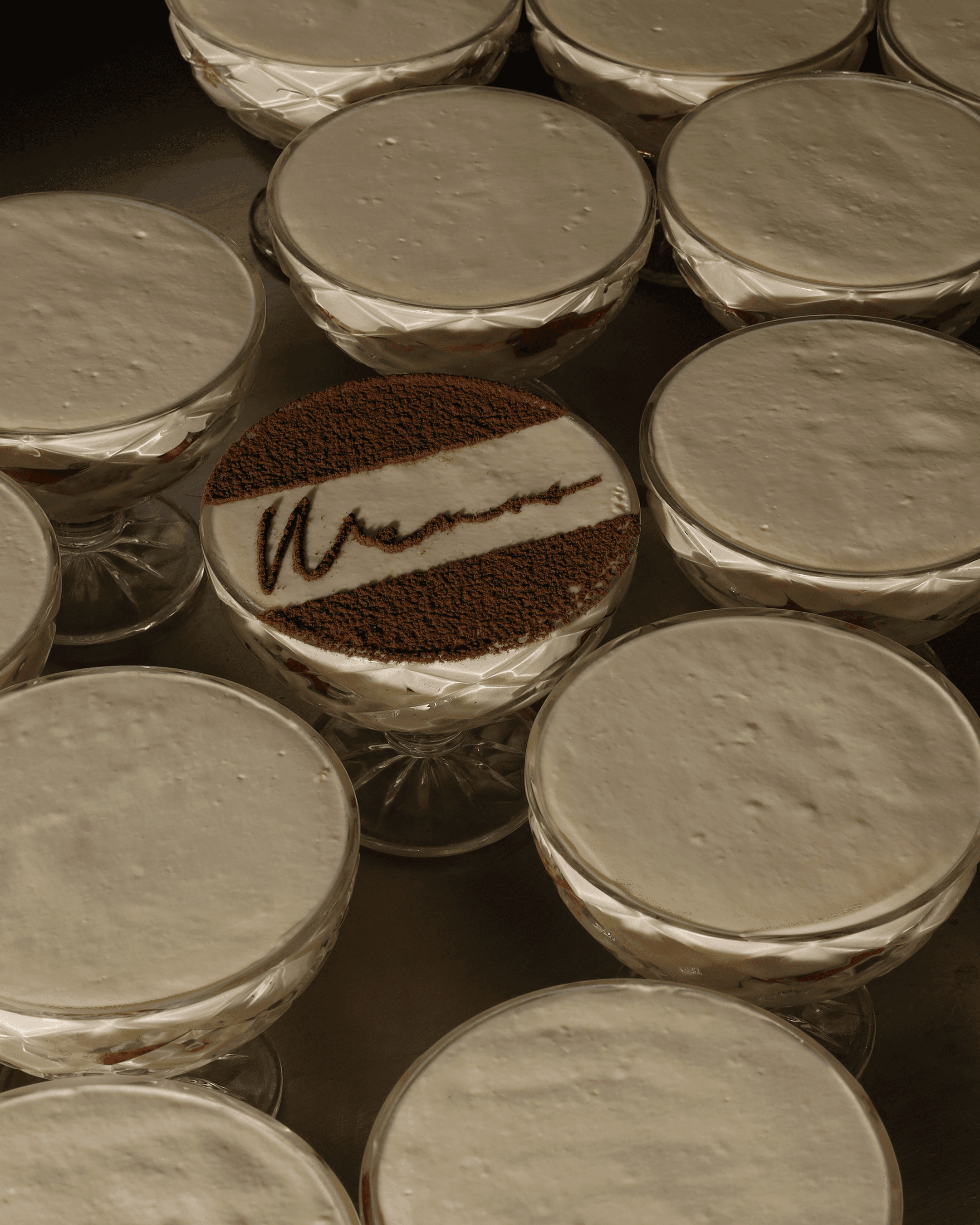 MEMOS tiramisu finished with a cocoa-dusted signature