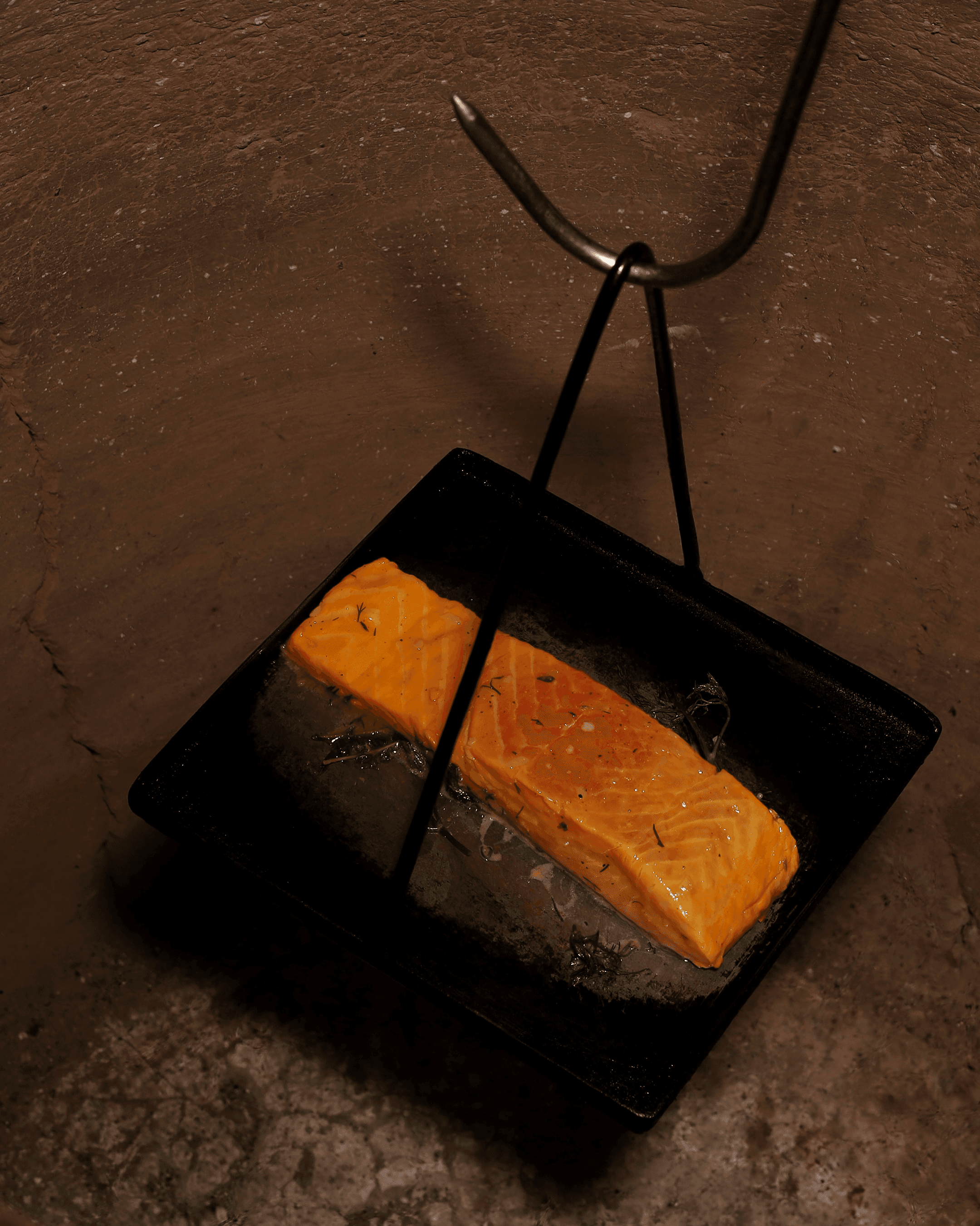 Marinated salmon fillet in a cast-iron pan