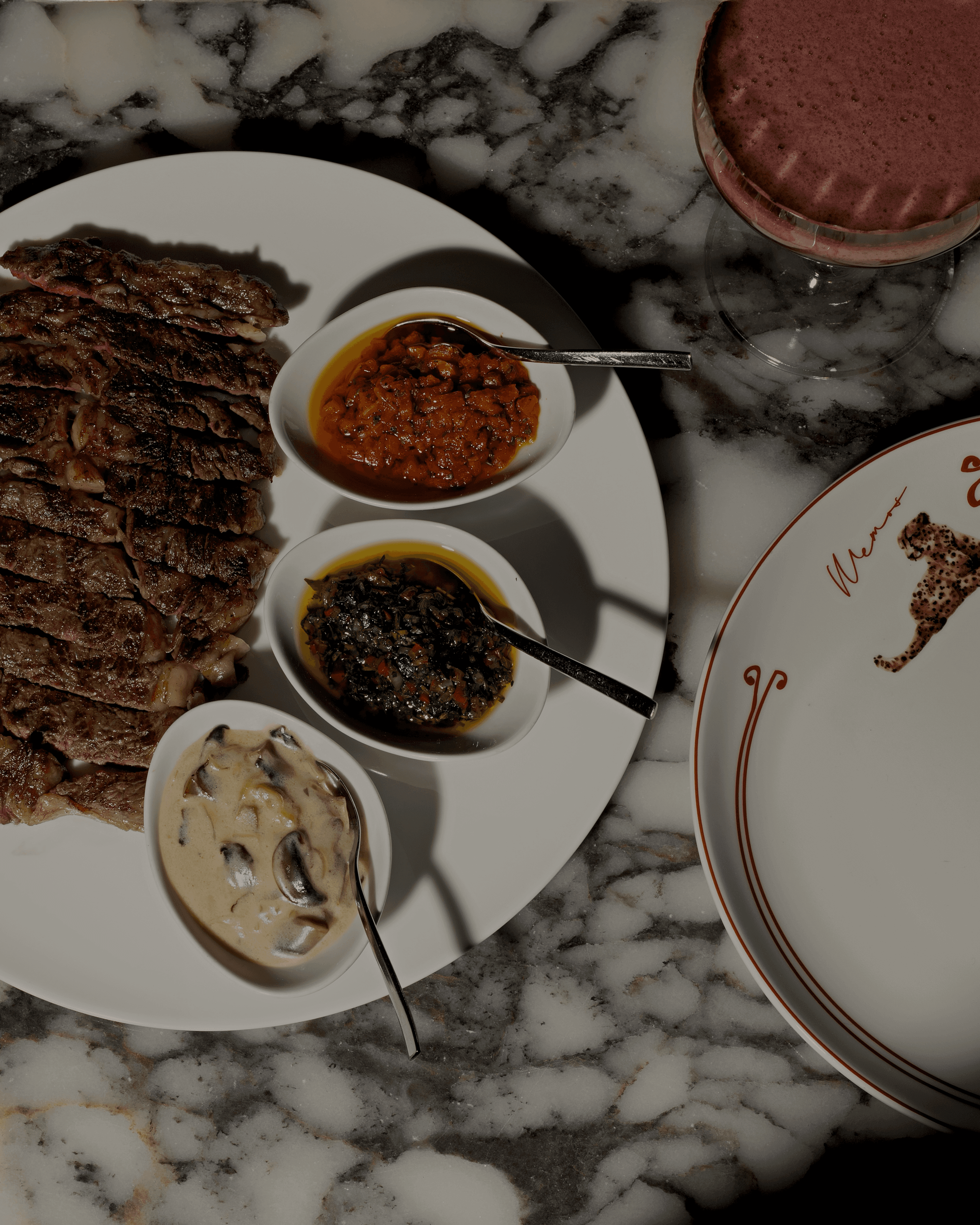 Sliced steak with a trio of house-made sauces